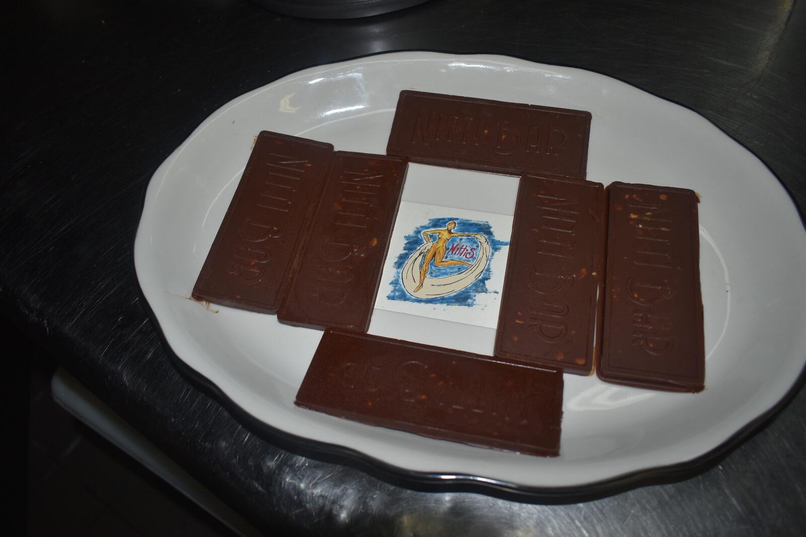 Nittis custom chocolate bars displayed on a white plate