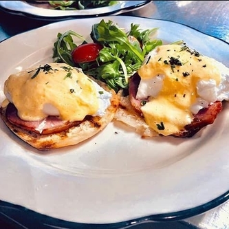 Egg benedict with a side salad